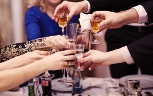 group of people toasting at wedding reception