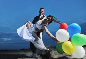 wedding bride and groom surprising guests with balloons