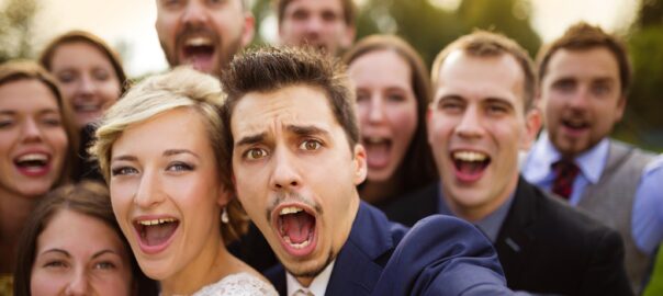 chicago wedding reception with couple and guests taking selfies
